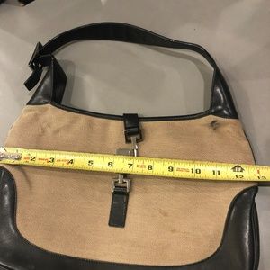 Black leather and tan canvas stylish Gucci bag.